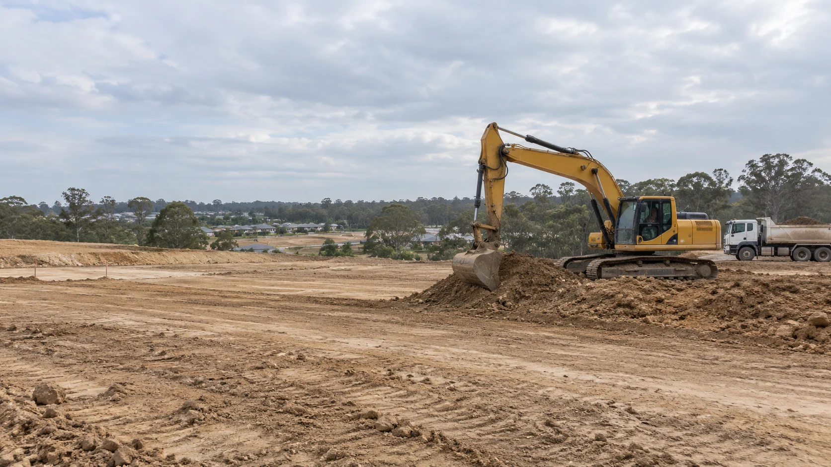 Illustrative earthworks site with a yellow excavator and tipper truck under soft daylight